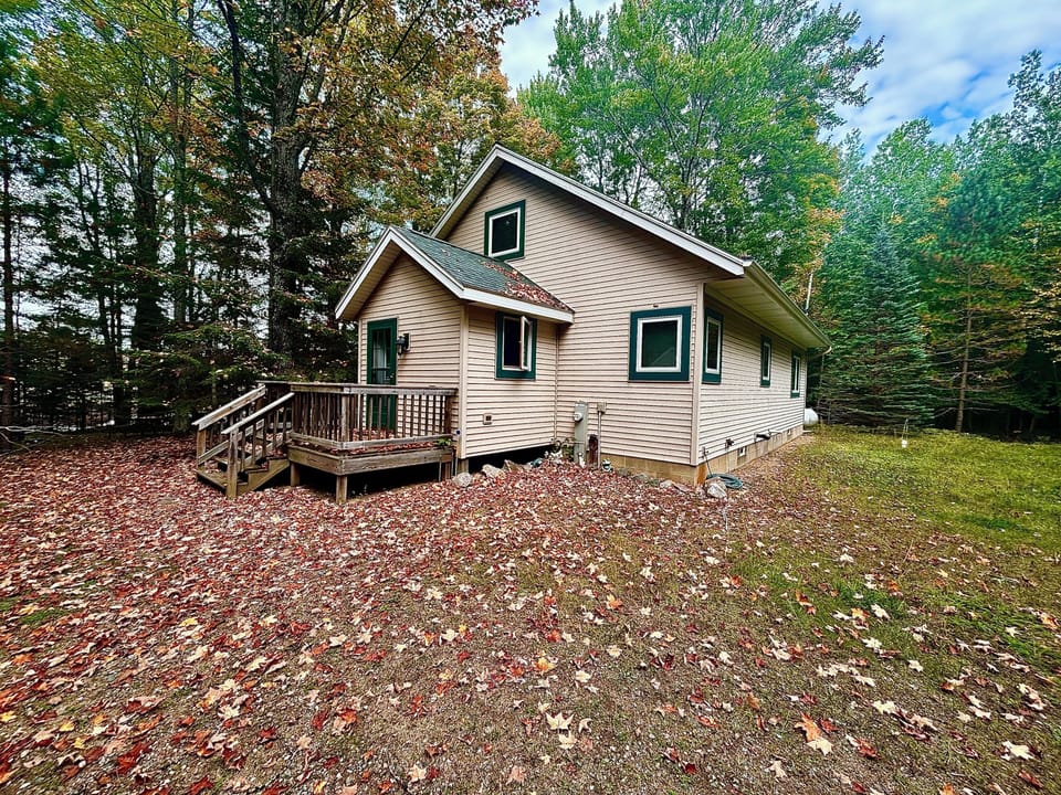 Front of the home featuring another private porch area. 