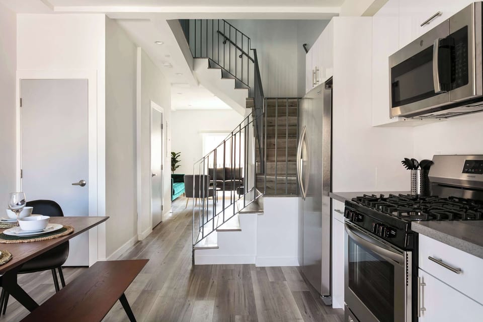 Spacious kitchen and hallway with contemporary finishes