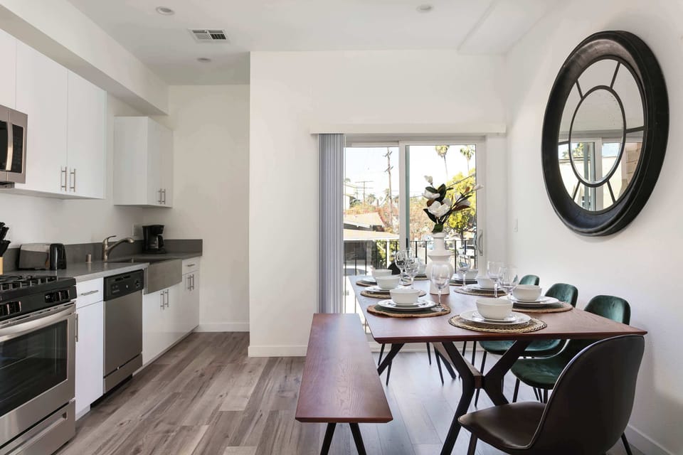 Open dining and kitchen layout with abundant natural light