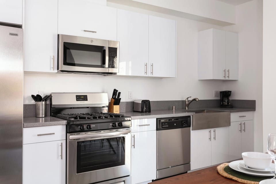 Fully equipped modern kitchen with stainless steel appliances
