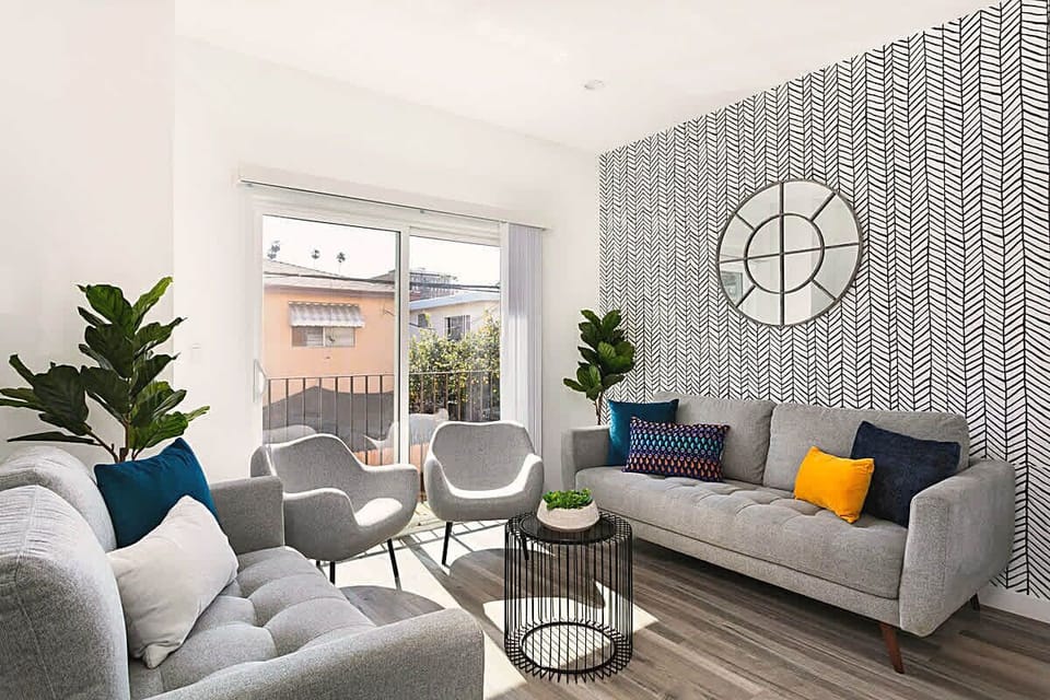 Bright and inviting living room with comfortable seating and natural light.