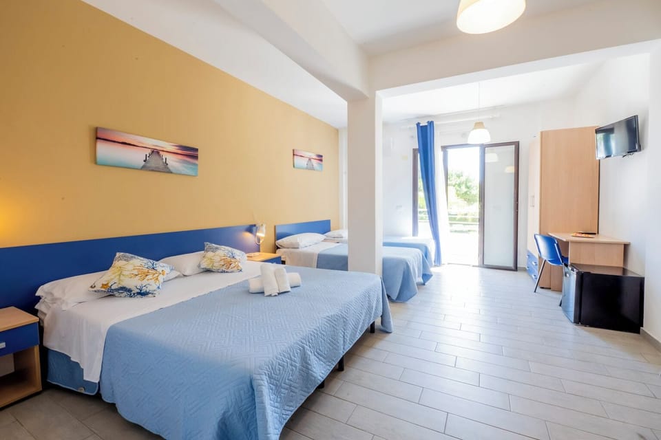 Quadruple Room, Sea View | Minibar (free items), desk, laptop workspace, WiFi (free)