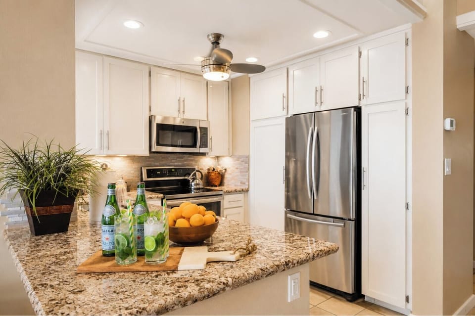  Open to the dining area, the kitchen layout makes it easy to cook, serve, and linger over meals together.