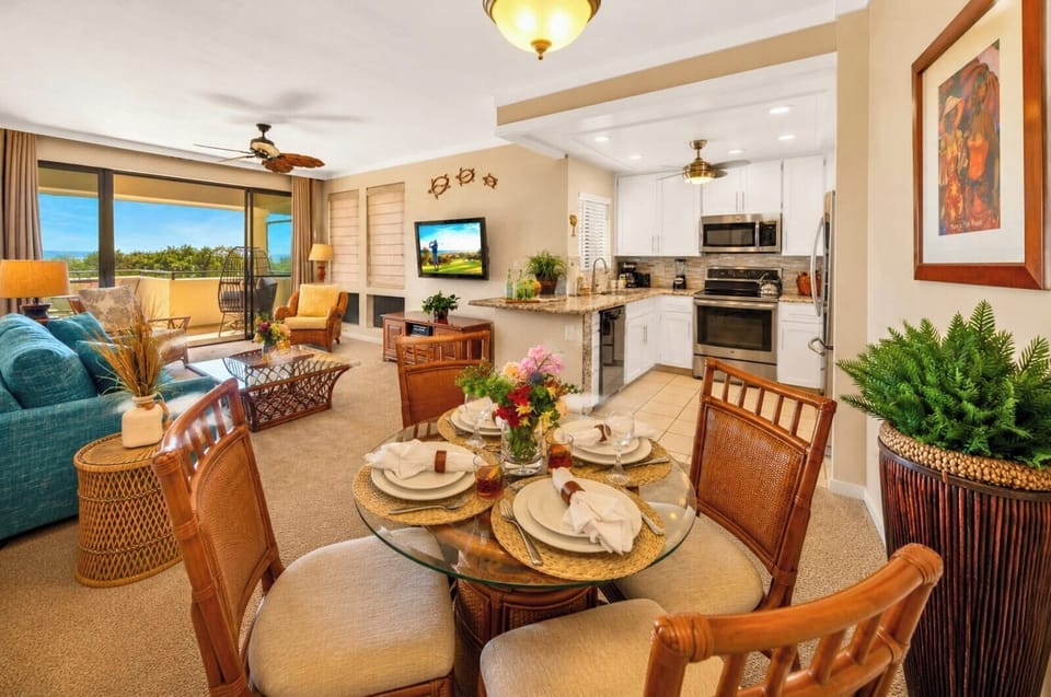 A dining table for four sits between the kitchen and living room, ready for breakfast in or a full sit-down meal.