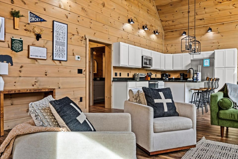 Natural light floods the space while soft textures and cozy chairs invite you to curl up and stay awhile.