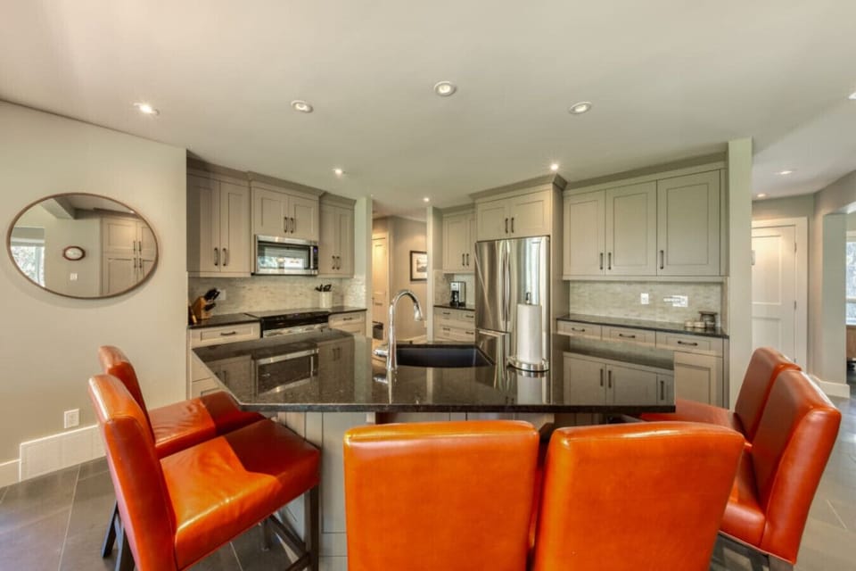 Full kitchen with a island seating for 6, drip coffee maker, blender, crockpot/slow cooker, rice cooker, ground coffee, sugar, tea, and basic condiments (ketchup, mustard, relish.)