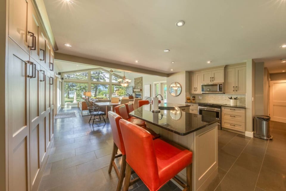 Full kitchen with a island seating for 6, drip coffee maker, blender, crockpot/slow cooker, rice cooker, ground coffee, sugar, tea, and basic condiments (ketchup, mustard, relish.)