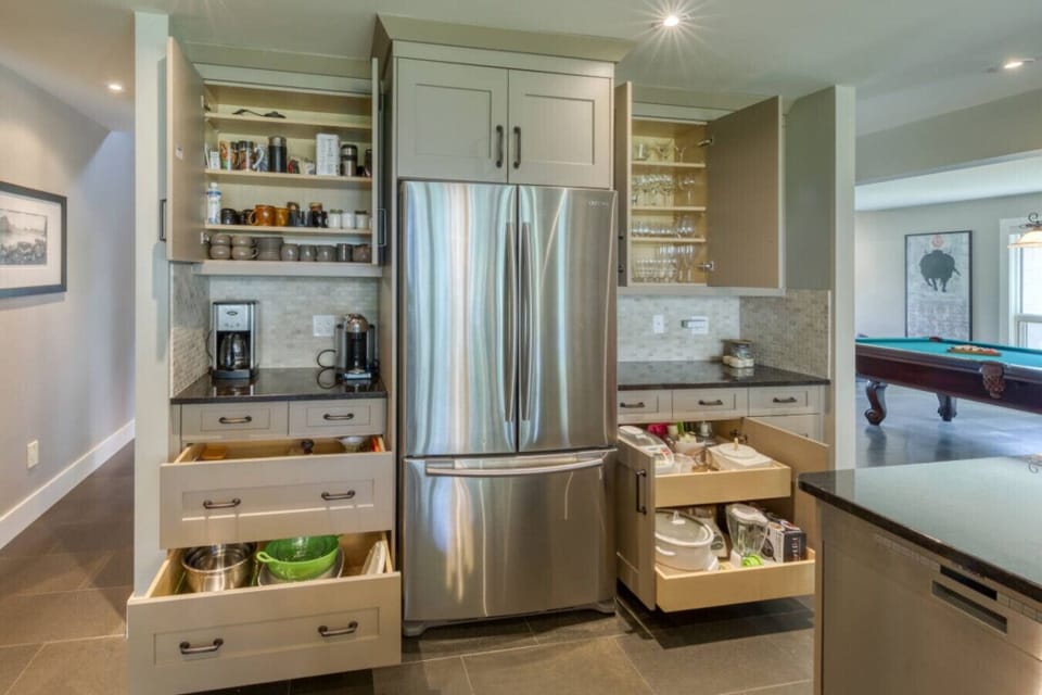 Full kitchen with a island seating for 6, drip coffee maker, blender, crockpot/slow cooker, rice cooker, ground coffee, sugar, tea, and basic condiments (ketchup, mustard, relish.)