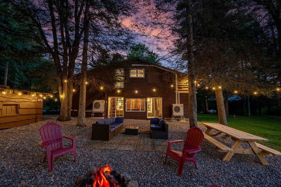 Back area with picnic table, firepit, and outdoor couch