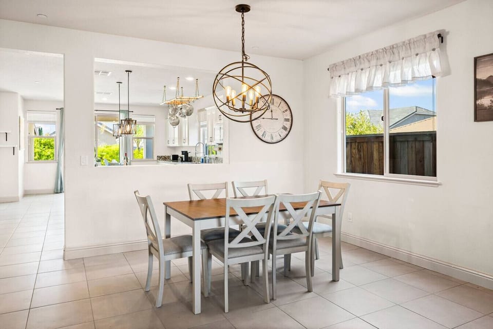 Gather for family meals and conversations around this inviting dining table.