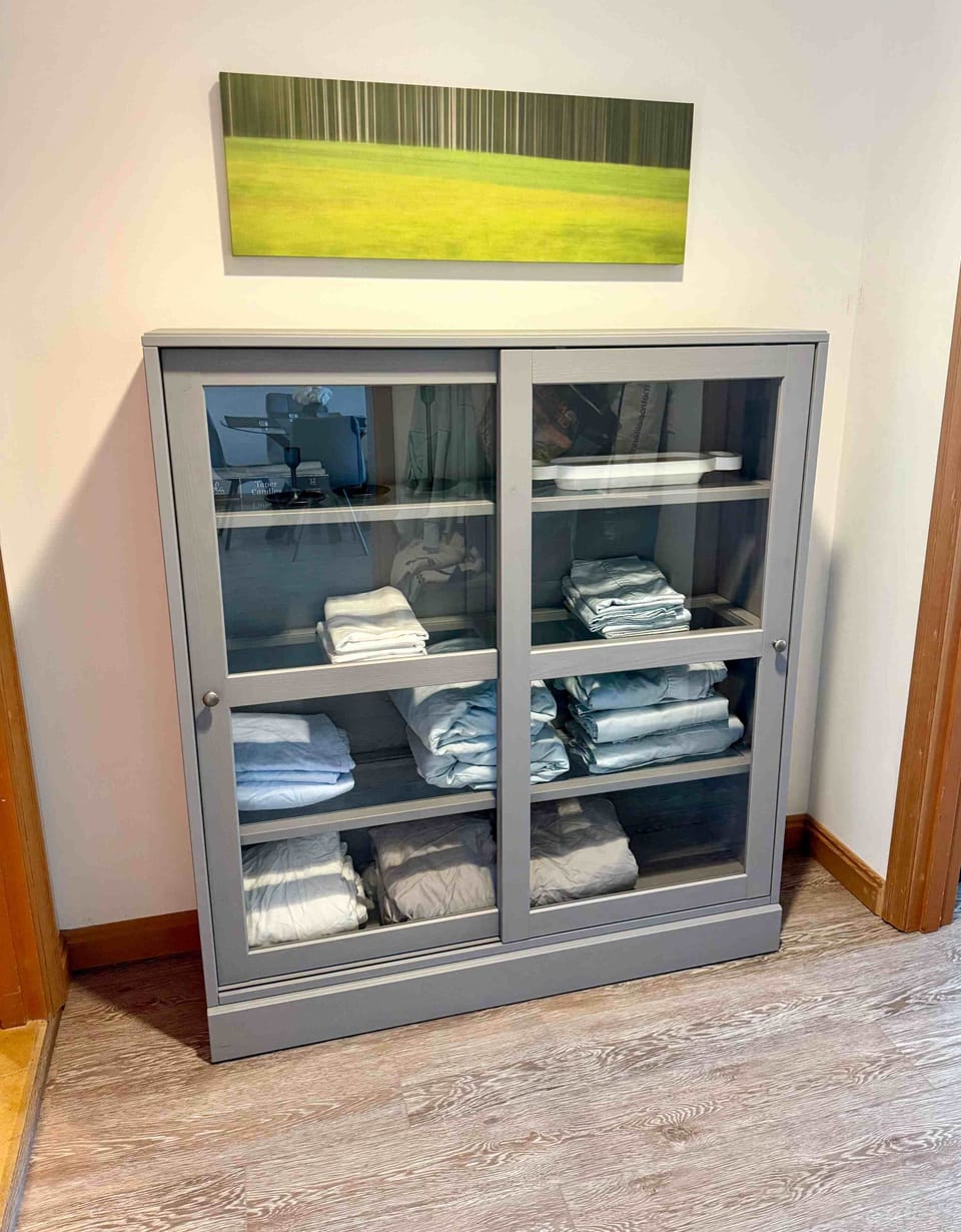 Linen cabinet - extra sheets and pillow cases for the sofa are here 