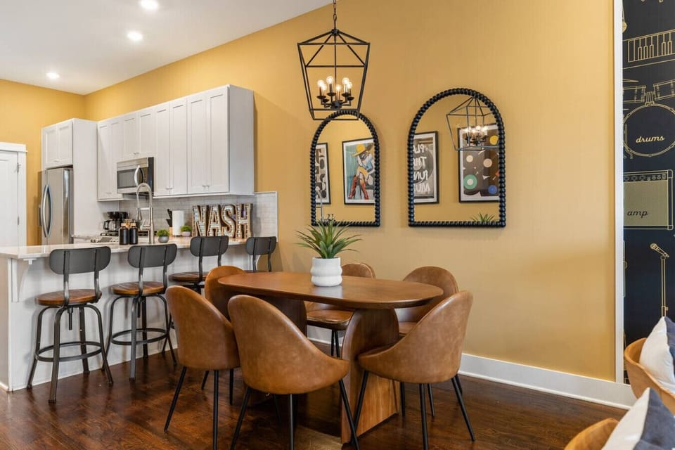 Fully equipped kitchen with high-end appliances, seating for 6 at our dining table, and seating for 4 at the kitchen bar.