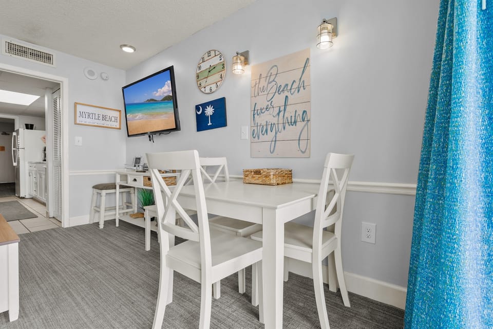 Smart tv for streaming. Table and chairs for meals, or as a makeshift office/ laptop area.