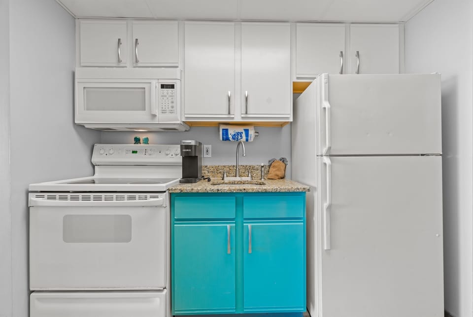 Full size fridge, range oven, microwave, coffee maker, dishes, utensils, basic pots and pans.