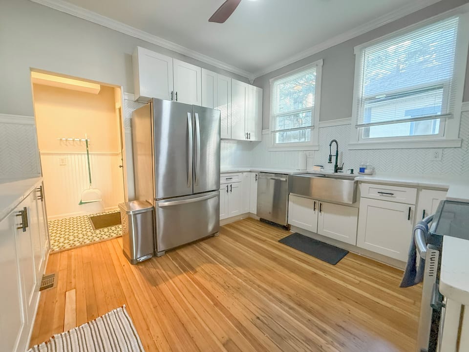 Spacious chef’s kitchen with fridge, freezer, dishwasher, and all essentials.