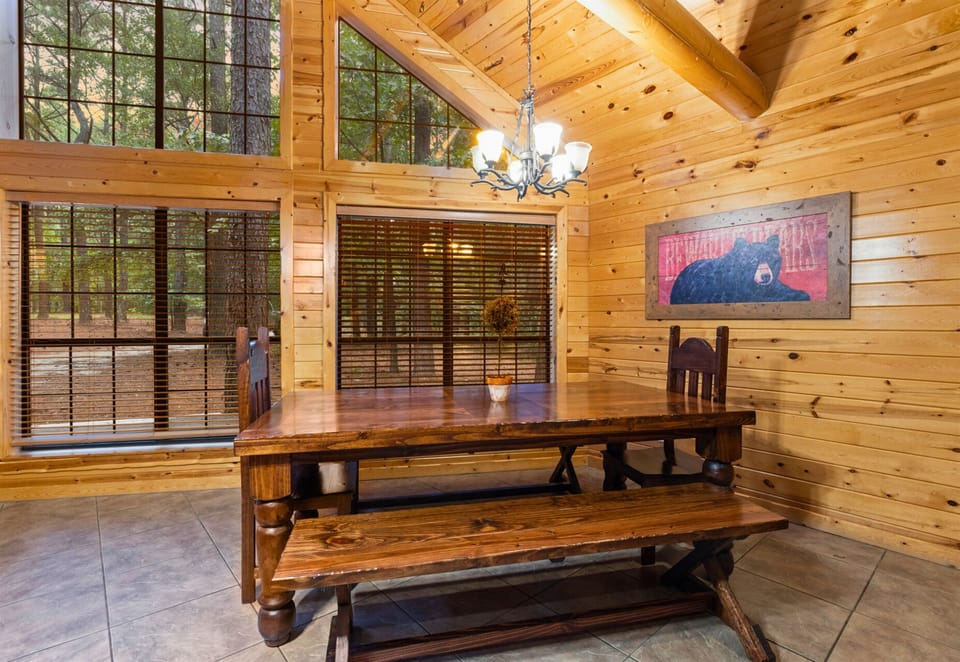 Dining nook with rustic chandelier and cozy bench seating