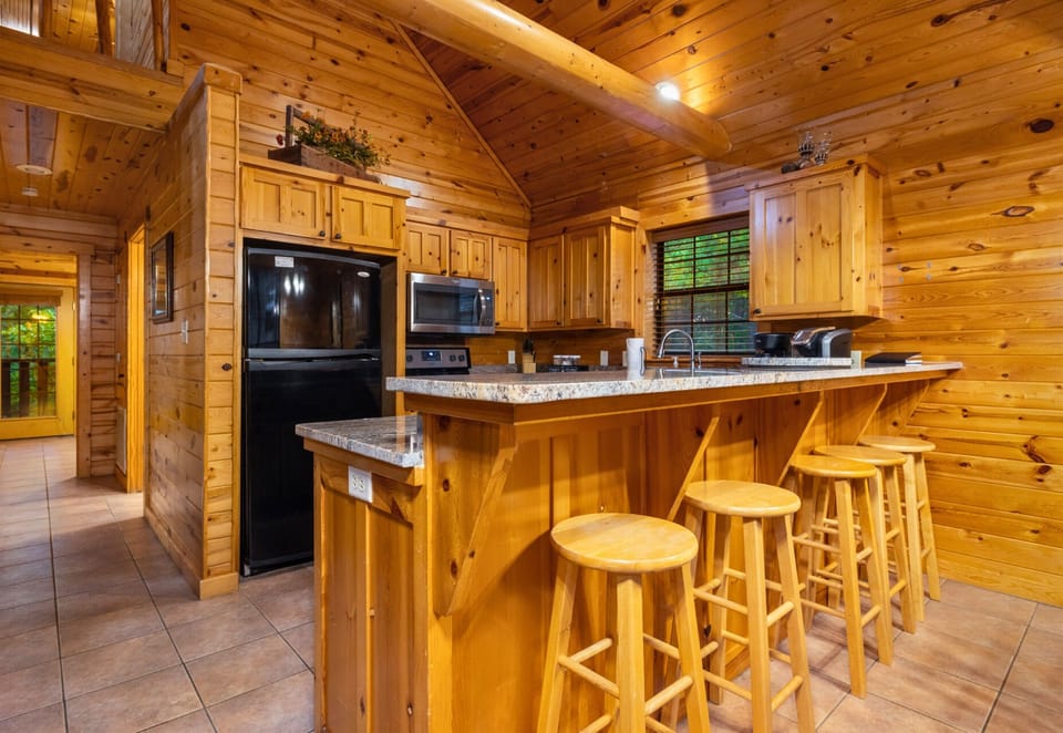 Kitchen island with bar stools for coffee or cocktails.