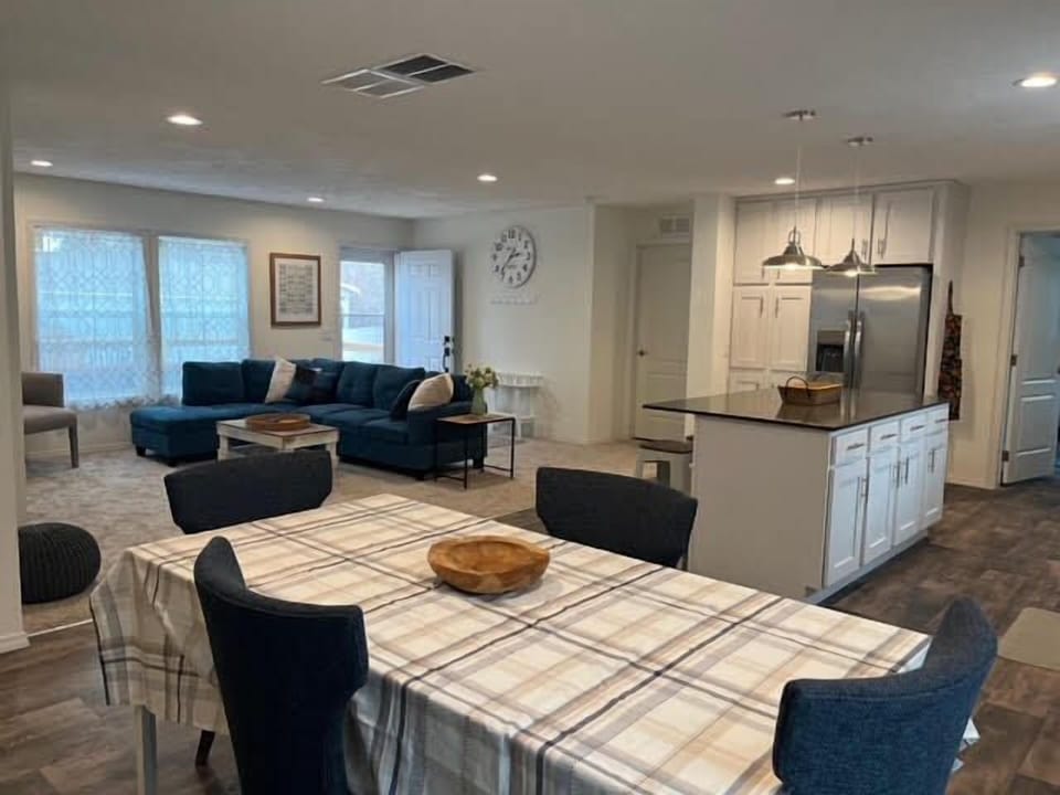 Dining table expands and has seating for 8 guests.