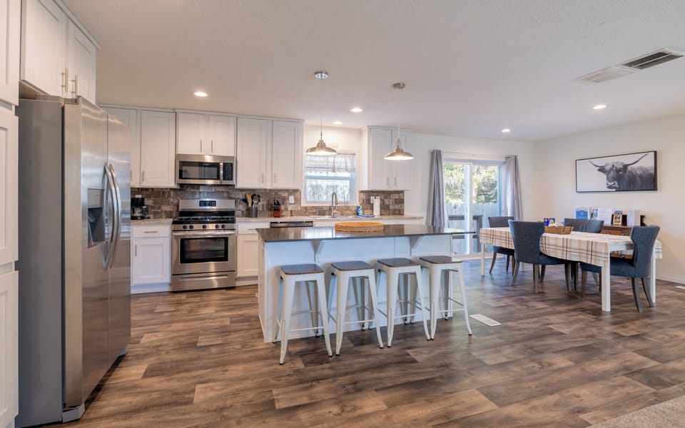 Enjoy meals together with seating at both the dining table as well as the large breakfast bar