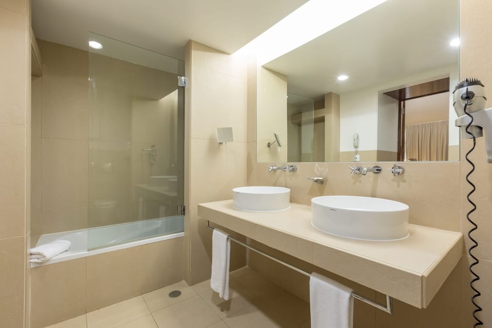 Shower, eco-friendly toiletries, hair dryer, slippers
