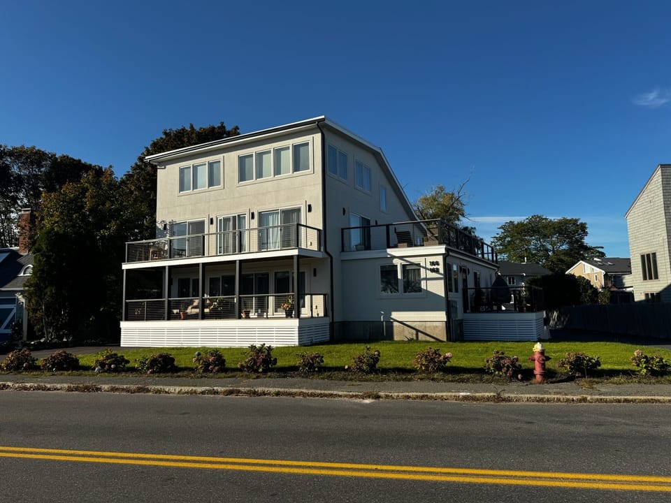 Modern coastal home with multiple decks and balconies