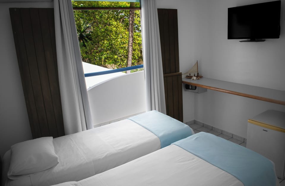 Standard Twin Room, 1 Bedroom, Private Bathroom, Sea View | Minibar, in-room safe, free WiFi, bed sheets