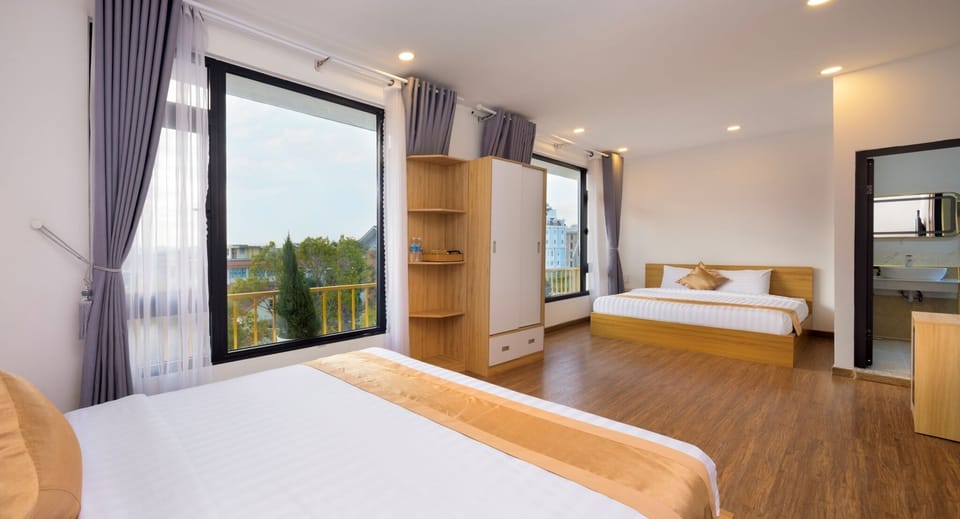 Luxury Quadruple Room | Desk, laptop workspace, blackout drapes, free WiFi