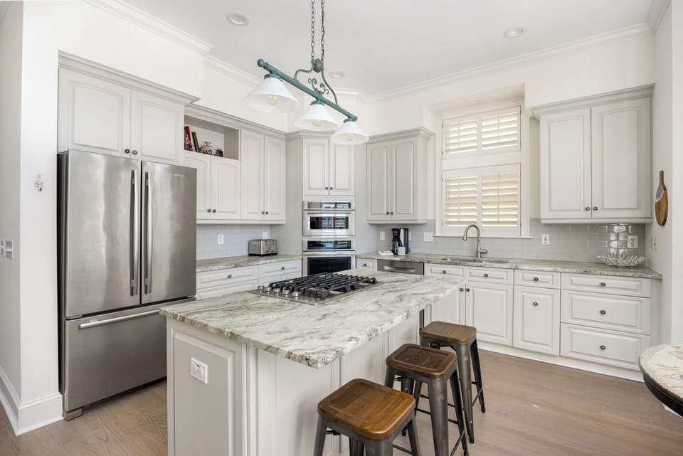 Light-filled kitchen with bar seating.