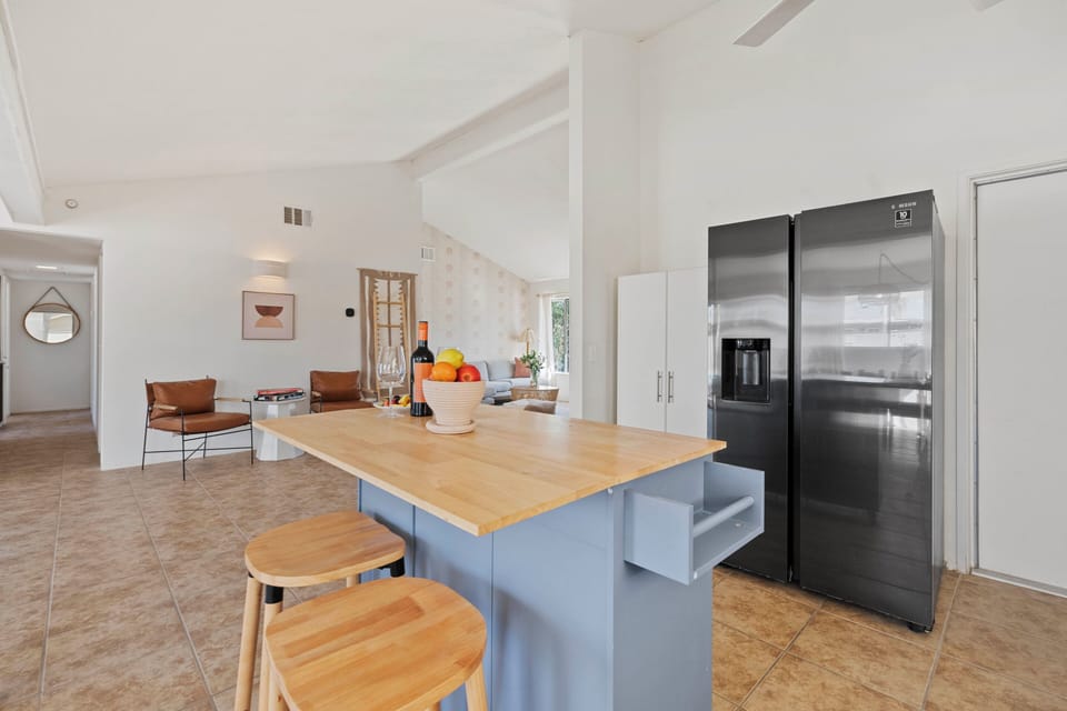 Sleek, modern kitchen with barstool seating.