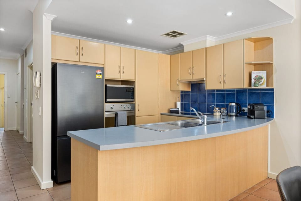 The kitchen, designed for convenience and functionality, offers generous bench space, an electric cooktop, a pod coffee machine and all the essentials for home-style cooking.