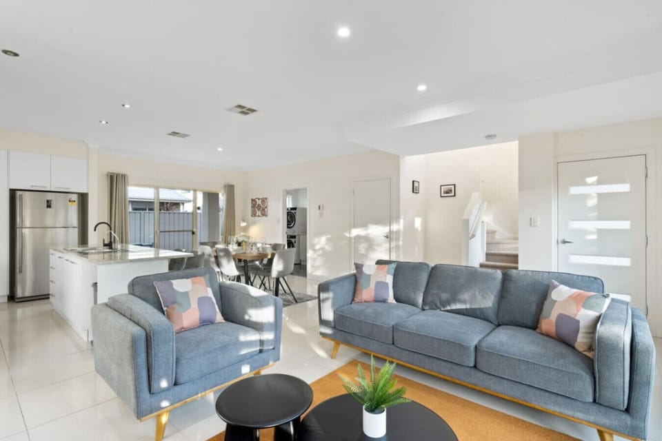 Relax in the inviting living area, where plush seating, ambient lighting, and a Smart TV set the scene for relaxing evenings after a day of exploring.