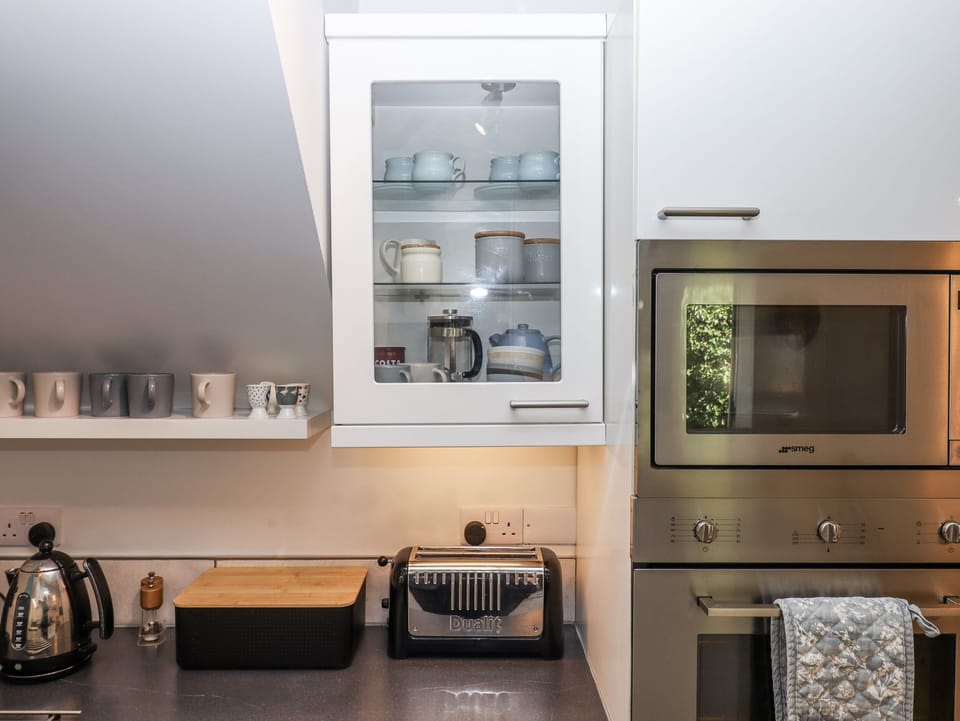 Fridge, microwave, toaster, cookware/dishes/utensils