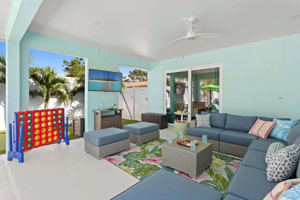 Outdoor Lounge: Enjoy vibrant views and fun games in this airy, stylish retreat!