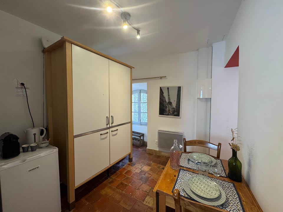 kitchen, microwave, dining table, chairs, fridge, coffee machine, kettle