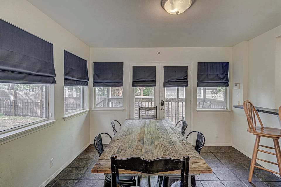 Sunlit dining space for 6 with access to the patio and backyard