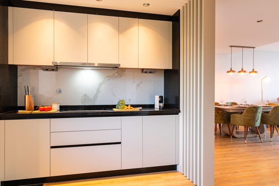 Open-plan kitchen and dining area with warm tones and light.