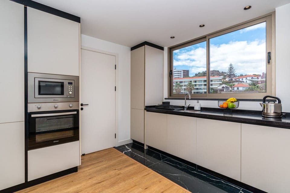 Fully equipped kitchen with modern appliances and stylish finishes.
