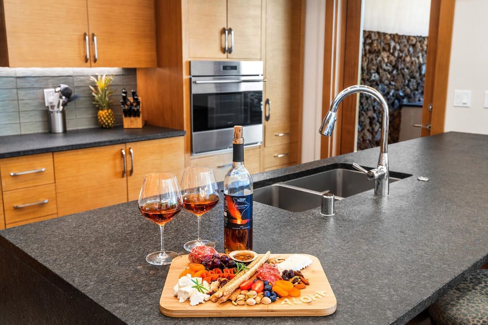 Set the tone for the evening with drinks and pupus on the oversized kitchen island.