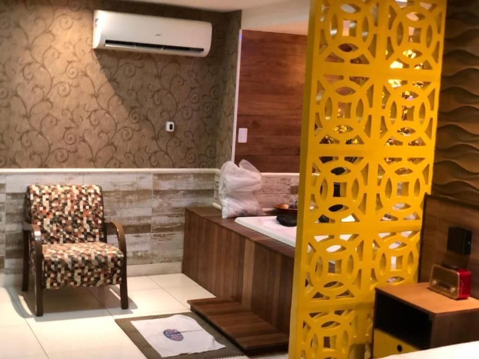 Luxury Suite, 1 Queen Bed | Living area | TV
