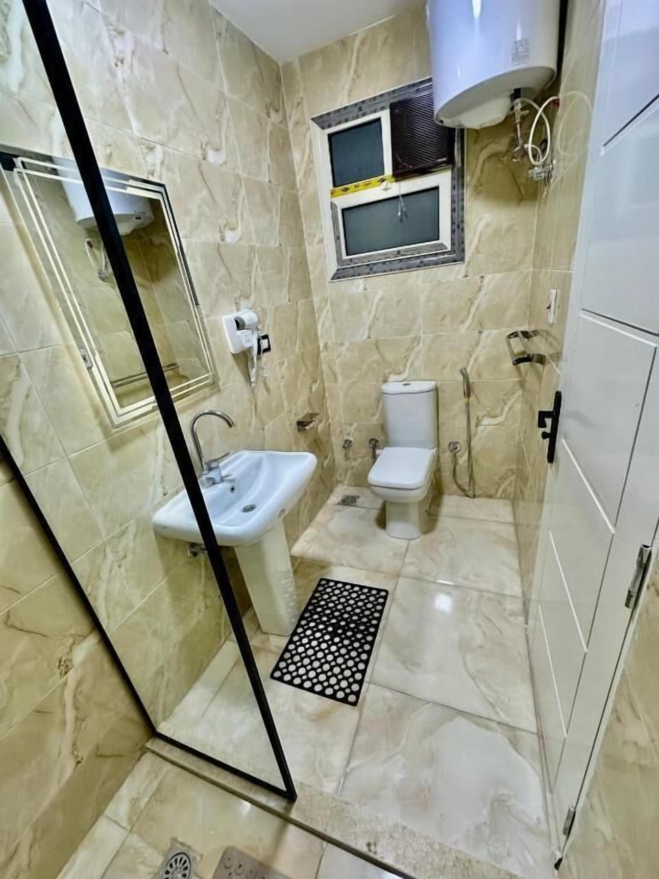 Rainfall showerhead, designer toiletries, hair dryer, slippers