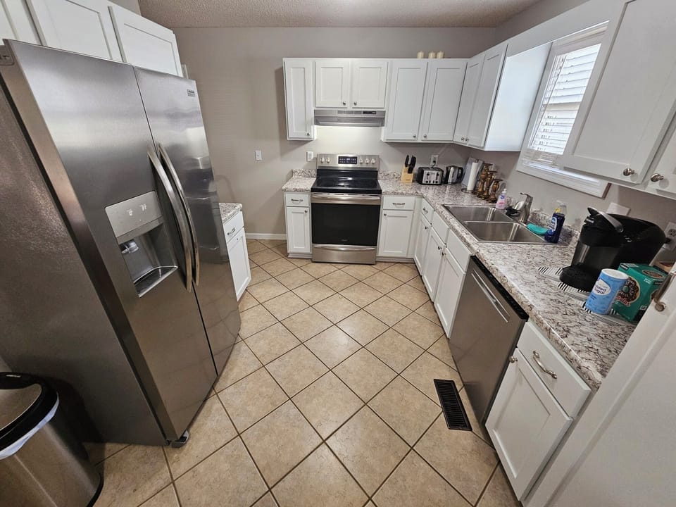Kitchen, cookware/utensils, dinnerware/silverware, Keurig, & garbage disposal.
