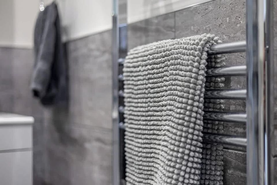 “Simple, spotless, and functional — a full bathroom for your comfort.”