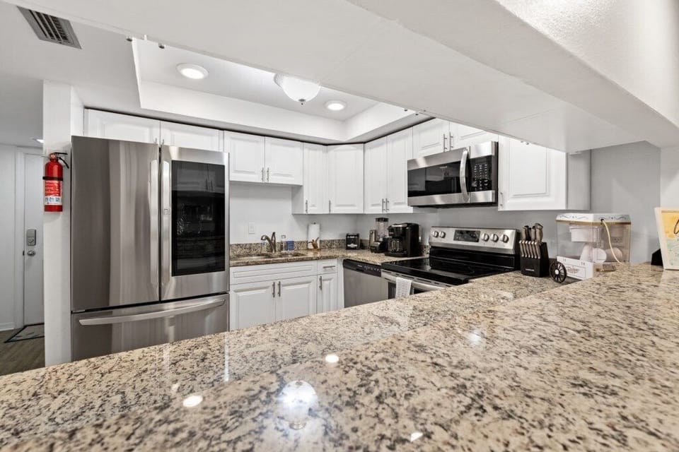 Condo, Multiple Beds, Balcony, Garden View (Pelican Inlet C119) | Private kitchen | Dining tables