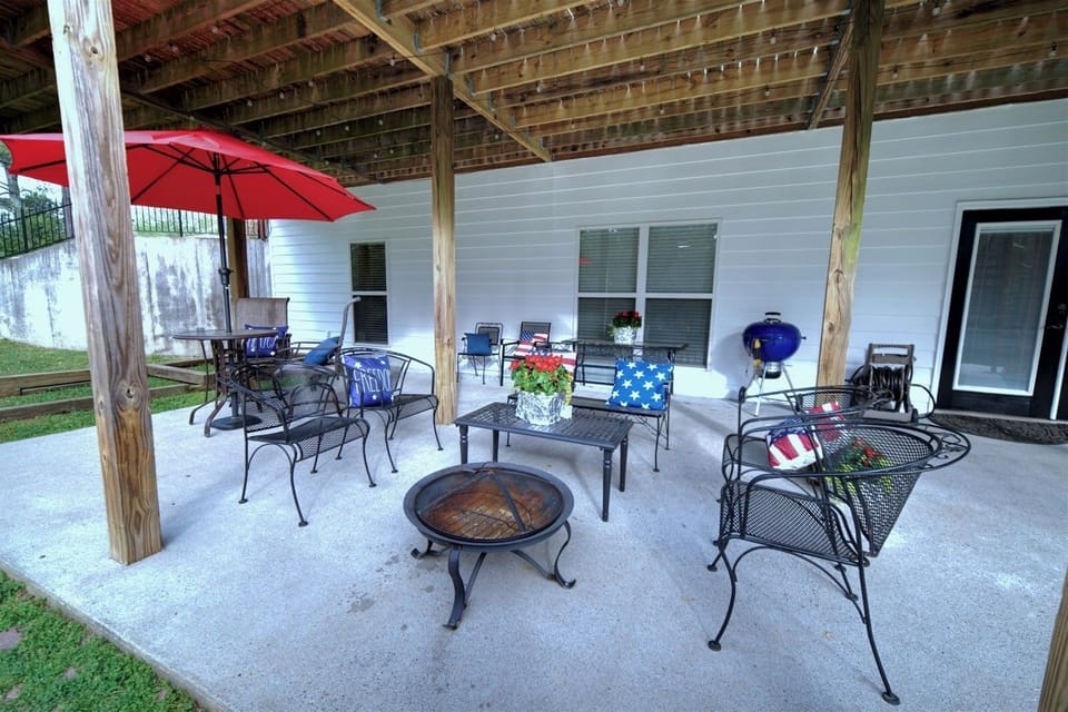 Patio with Weber grill, dining and elegant outdoor lighting and fire pit