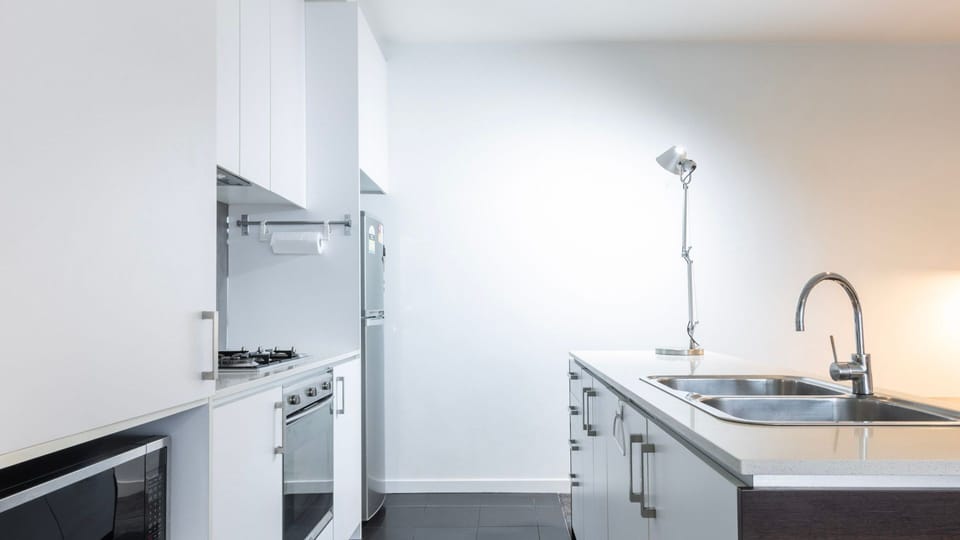 Prepare meals with ease in the sleek kitchen with gas cooktop.