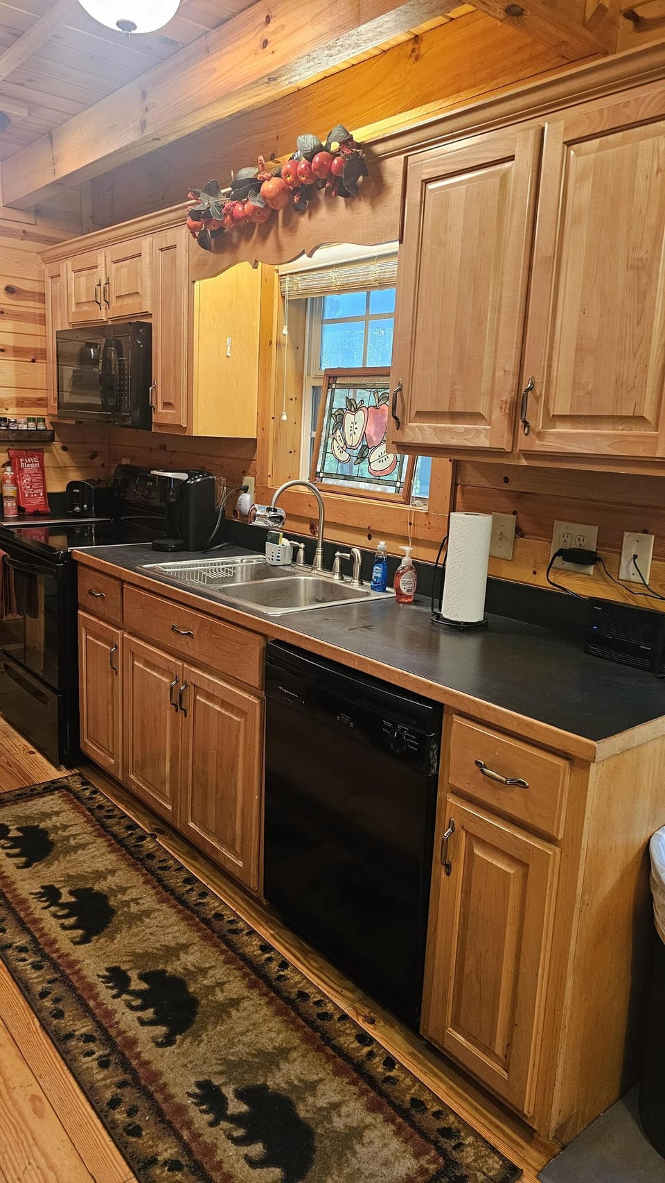 Kitchen with warm wood cabinetry and modern appliances