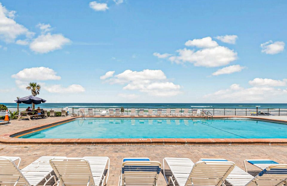 Soak up some sun and take in mesmerizing ocean views by the pristine beachfront pool