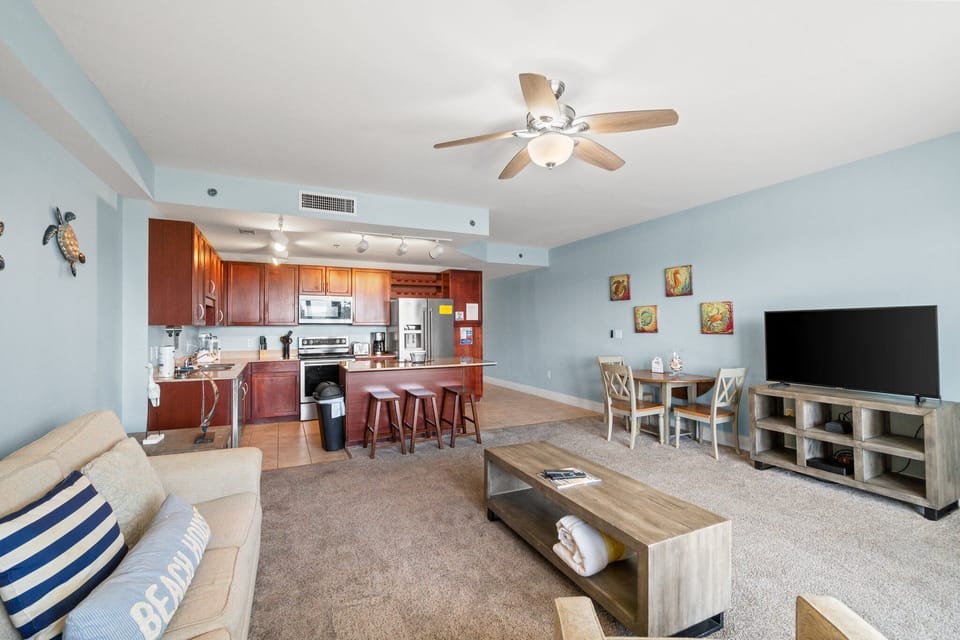 The open floor plan flows seamlessly into the dining area and kitchen, making it easy to entertain, share meals, or simply stay connected with loved ones.