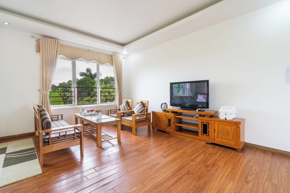 Standard Quadruple Room, Garden View | Pillowtop beds, in-room safe, desk, blackout drapes