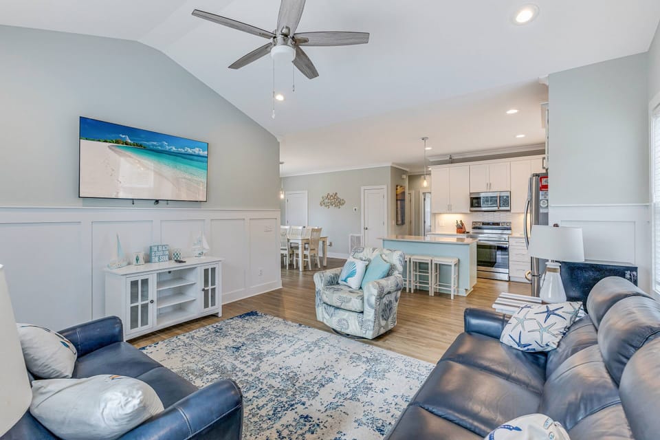 Living area: Cozy space with beachy vibes and your own big screen TV, this area is adjacent to the kitchen.